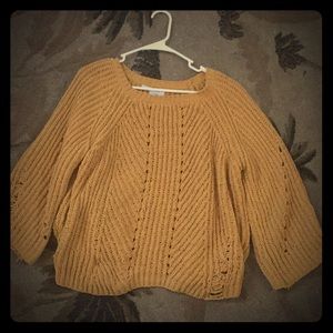 This is a yellow cardigan has been used lightly
